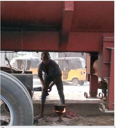 Conductor Cooking Under Petrol Tanker